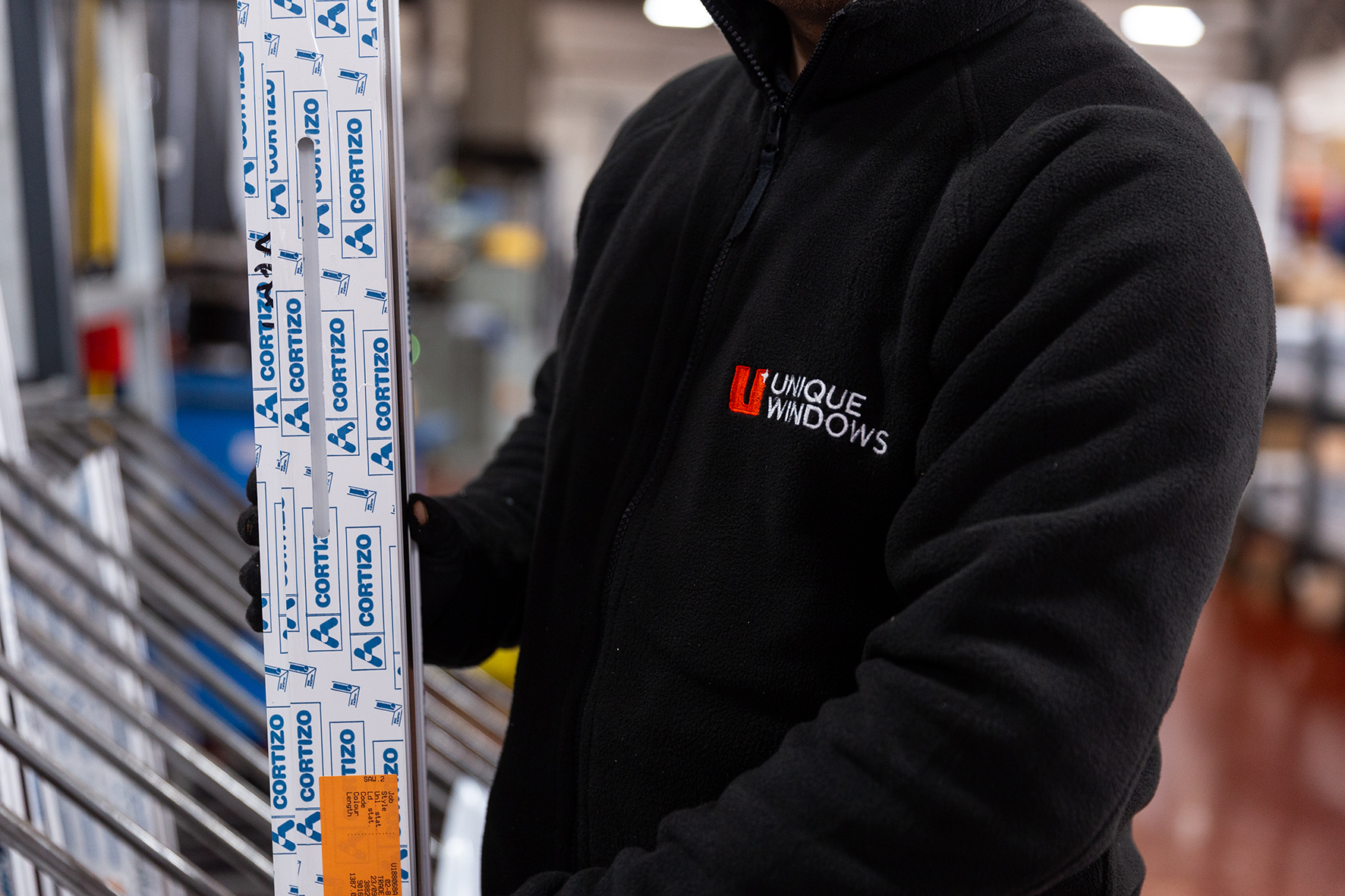 Image of Unique fabrication operative holding CORTIZO aluminium profile